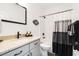 Updated bathroom includes tub and shower combo, updated fixtures, granite countertops, and decorative accents at 2588 Long Avenue Ext., Conway, SC 29526