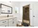 Modern bathroom featuring a vanity with a granite countertop, black hardware, and a tiled walk-in shower at 2588 Long Avenue Ext., Conway, SC 29526