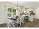 Charming dining area featuring a rustic wood table, seating for six, and an abundance of natural light at 2588 Long Avenue Ext., Conway, SC 29526