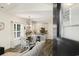 Open-concept dining area and kitchen with modern cabinets and hardwood floors at 2588 Long Avenue Ext., Conway, SC 29526