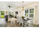 Open living and dining area with a dining table, comfortable sofa, and ample natural light at 2588 Long Avenue Ext., Conway, SC 29526