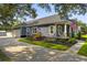 Exterior showcases a driveway leading to a two-car garage and a well-maintained yard at 2588 Long Avenue Ext., Conway, SC 29526