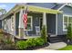 Inviting front porch with rocking chairs, American flag, and a cozy atmosphere at 2588 Long Avenue Ext., Conway, SC 29526
