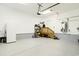 Spacious garage with epoxy flooring, staircase, and ample storage space at 2588 Long Avenue Ext., Conway, SC 29526