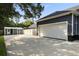 Spacious two-car garage and shed with a concrete driveway and fenced yard at 2588 Long Avenue Ext., Conway, SC 29526