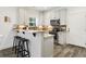 Well-lit kitchen featuring white cabinets, stainless steel appliances, brick backsplash, and granite countertops at 2588 Long Avenue Ext., Conway, SC 29526