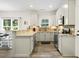Stylish kitchen with white cabinets, stainless steel appliances, brick backsplash, and granite countertops at 2588 Long Avenue Ext., Conway, SC 29526