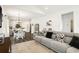 Bright living space flowing into a dining area with a comfortable sofa and a kitchen in the background at 2588 Long Avenue Ext., Conway, SC 29526