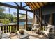Comfortable outdoor patio space with neutral colored furniture and a beautiful view of the backyard pool at 2588 Long Avenue Ext., Conway, SC 29526