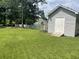 Spacious backyard features a storage shed and white picket fence at 312 Trace Run, Myrtle Beach, SC 29588