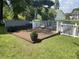 Wood deck with bench seating and white picket fence at 312 Trace Run, Myrtle Beach, SC 29588