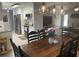 Open dining area with modern light fixtures and view into updated kitchen at 312 Trace Run, Myrtle Beach, SC 29588