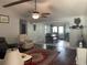 Inviting living room with hardwood floors, ceiling fan, and view into dining area at 312 Trace Run, Myrtle Beach, SC 29588