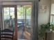 Relaxing view into the screened-in porch with outdoor furniture at 312 Trace Run, Myrtle Beach, SC 29588