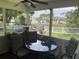 Relaxing screened porch with ceiling fan and view of back yard at 312 Trace Run, Myrtle Beach, SC 29588