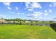A sprawling green backyard with serene pond views, great for relaxation and outdoor enjoyment at 317 Truce St., Myrtle Beach, SC 29588