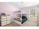 Charming ' bedroom featuring a white bunk bed frame and a window with natural light at 317 Truce St., Myrtle Beach, SC 29588