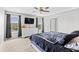 This primary bedroom features a ceiling fan, ensuite bathroom, and a waterfront view at 317 Truce St., Myrtle Beach, SC 29588