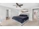 A spacious bedroom featuring a ceiling fan, neutral decor, and carpet flooring at 317 Truce St., Myrtle Beach, SC 29588