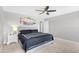 A spacious bedroom featuring a ceiling fan, neutral decor, and carpet flooring at 317 Truce St., Myrtle Beach, SC 29588