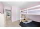 bedroom featuring a white bunk bed, light pink walls, and plush carpeting at 317 Truce St., Myrtle Beach, SC 29588