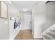 A modern entryway with hooks, leading to stairs and a white front door at 317 Truce St., Myrtle Beach, SC 29588