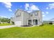 Charming two-story home with a well-manicured lawn, attached garage and inviting front porch at 317 Truce St., Myrtle Beach, SC 29588