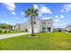 Lovely two-story home featuring a well-kept lawn, front porch, and a palm tree in the front yard at 317 Truce St., Myrtle Beach, SC 29588