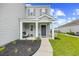 Inviting front porch with seating area and landscaping, creating a welcoming entrance to the home at 317 Truce St., Myrtle Beach, SC 29588