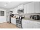 This kitchen features stainless steel appliances, white cabinets, and granite countertops at 317 Truce St., Myrtle Beach, SC 29588