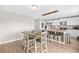 Well-lit kitchen featuring an island with breakfast bar and adjacent dining area at 317 Truce St., Myrtle Beach, SC 29588