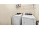 A well-lit laundry room featuring white front-load washer and dryer units at 317 Truce St., Myrtle Beach, SC 29588