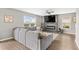 Cozy living room with gray sectional sofa, electric fireplace, large windows and modern decor at 317 Truce St., Myrtle Beach, SC 29588