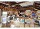 Unfinished attic space featuring exposed rafters, with lighting and plywood flooring at 325 Orange St., Georgetown, SC 29440