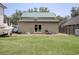 View of large backyard, boat and trailer, barbecue pit, and an outbuilding at 325 Orange St., Georgetown, SC 29440