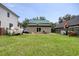 Large backyard with boat, trailer and detached structure with a green metal roof at 325 Orange St., Georgetown, SC 29440