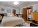 Inviting bedroom with a comfortable bed, decorative art, and an ensuite bathroom at 325 Orange St., Georgetown, SC 29440