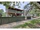 Two-story home with front porch and balcony with vintage rocking chairs at 325 Orange St., Georgetown, SC 29440