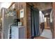 Interior hallway featuring wooden walls and flooring, leading to another room at 325 Orange St., Georgetown, SC 29440