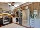 Well-equipped kitchen with stainless steel appliances and adjacent laundry area for convenience at 325 Orange St., Georgetown, SC 29440