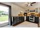 Cozy kitchen featuring two-tone cabinetry, stainless steel appliances, and access to outdoor space at 325 Orange St., Georgetown, SC 29440