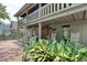 Inviting front porch featuring rocking chairs and lush greenery, creating a relaxing outdoor space at 325 Orange St., Georgetown, SC 29440