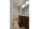 This is the bathroom with double sinks, medicine cabinet, and tile floors at 340 Barony Dr., Conway, SC 29526