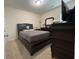 Bedroom has neutral walls and carpeting along with dark wooden furniture and a large TV at 340 Barony Dr., Conway, SC 29526