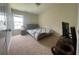 This cozy bedroom features a large window and neutral carpet, creating a relaxing and inviting space at 340 Barony Dr., Conway, SC 29526