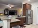 Spacious kitchen and living area featuring stainless steel appliances and granite countertops at 340 Barony Dr., Conway, SC 29526