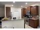 Modern kitchen featuring stainless steel appliances, granite countertops, and dark cabinets at 340 Barony Dr., Conway, SC 29526