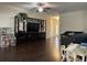 Spacious living room featuring hardwood floors, a ceiling fan, and seamless flow to the dining area at 340 Barony Dr., Conway, SC 29526