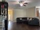 Spacious living room with hardwood floors, a comfortable couch, and modern decor at 340 Barony Dr., Conway, SC 29526