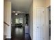 Bright living room featuring hardwood floors, a ceiling fan, and a large window for natural light at 340 Barony Dr., Conway, SC 29526